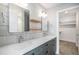 Bathroom features double sinks, modern fixtures, stylish tile, and a walk-in closet at 2831 W 25Th Ave # 3, Denver, CO 80211