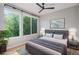 Cozy bedroom with large windows, ceiling fan, and stylish decor at 2831 W 25Th Ave # 3, Denver, CO 80211