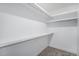 Walk-in closet with shelves and gray carpet flooring at 2831 W 25Th Ave # 3, Denver, CO 80211