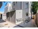 Modern exterior of home with metal siding, gas meters, and bicycle parked outside at 2831 W 25Th Ave # 3, Denver, CO 80211