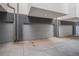 Row of garages with gray doors and concrete driveway at 2831 W 25Th Ave # 3, Denver, CO 80211