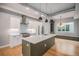 Open kitchen showcases stainless steel appliances, a center island, and hardwood flooring at 2831 W 25Th Ave # 3, Denver, CO 80211
