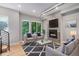 Bright living room features a modern fireplace, large windows, and stylish furnishings at 2831 W 25Th Ave # 3, Denver, CO 80211