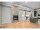 Modern living room with hardwood floors, a contemporary fireplace, and ample natural light at 2831 W 25Th Ave # 3, Denver, CO 80211