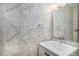 Stylish powder room featuring patterned wallpaper and modern vanity at 2831 W 25Th Ave # 3, Denver, CO 80211