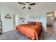 King bedroom with ceiling fan and access to bathroom at 4460 S Jebel Ln, Centennial, CO 80015
