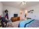 Cozy bedroom with built-in dresser and access to a full bathroom at 4460 S Jebel Ln, Centennial, CO 80015