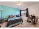 bedroom with teal walls and polka dot bedding at 4460 S Jebel Ln, Centennial, CO 80015