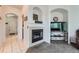 Bright hallway with a view of the living room and fireplace at 4460 S Jebel Ln, Centennial, CO 80015