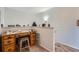 Small home office space with wooden desk and chair, near staircase at 4460 S Jebel Ln, Centennial, CO 80015
