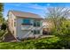 Backyard showcasing lush lawn, well-maintained landscaping, and a charming home exterior at 20592 E Lake Ave, Centennial, CO 80016