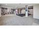 Spacious finished basement with carpeting, recessed lighting, and ample space for recreation and workout equipment at 20592 E Lake Ave, Centennial, CO 80016
