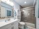 Bathroom featuring a tiled shower, vanity with ample storage, and modern fixtures at 20592 E Lake Ave, Centennial, CO 80016