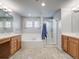 Bathroom with tiled floor, soaking tub with tile surround and glass door shower at 20592 E Lake Ave, Centennial, CO 80016