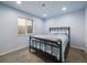 Bedroom featuring natural light, a window, soft carpeting, and light blue walls at 20592 E Lake Ave, Centennial, CO 80016