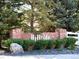 Attractive brick sign for Hillside community, surrounded by mature trees and landscaping at 20592 E Lake Ave, Centennial, CO 80016