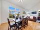 Bright dining room with large windows, a fireplace, and an adjacent living room at 20592 E Lake Ave, Centennial, CO 80016