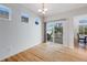 Bright dining area with hardwood floors, a sliding door to a deck, and natural lighting at 20592 E Lake Ave, Centennial, CO 80016