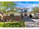 Charming two-story home with a well-maintained lawn, and a welcoming front porch at 20592 E Lake Ave, Centennial, CO 80016