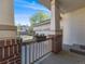 Welcoming front porch with brick columns, flower box, and a view of the garage at 20592 E Lake Ave, Centennial, CO 80016