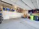 Spacious garage with ample storage solutions, organized shelving, and a clean, painted floor at 20592 E Lake Ave, Centennial, CO 80016