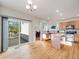 Open kitchen area with light wood cabinets, stainless steel appliances, and hardwood floors at 20592 E Lake Ave, Centennial, CO 80016