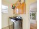 Laundry area with front-loading machines and built-in cabinets for storage at 20592 E Lake Ave, Centennial, CO 80016