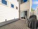 Outdoor patio with chairs and a grill, perfect for entertaining and relaxation at 20592 E Lake Ave, Centennial, CO 80016