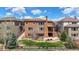 Aerial view showcasing the backyard, patio, and landscaping of this beautiful home at 15314 W Baker Ave, Lakewood, CO 80228