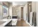 Relaxing bathroom featuring a soaking tub, walk-in shower, and modern finishes at 15314 W Baker Ave, Lakewood, CO 80228