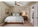 Comfortable bedroom featuring a decorative ceiling fan and a staircase right outside the doorway at 15314 W Baker Ave, Lakewood, CO 80228