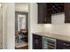 Convenient wet bar area offers a wine refrigerator, wine rack, and counter space at 15314 W Baker Ave, Lakewood, CO 80228