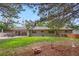 This backyard has mature trees, patio and a well maintained lawn at 3194 S Milwaukee St, Denver, CO 80210