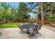 Spacious backyard features a stone patio with outdoor dining and plenty of shade at 3194 S Milwaukee St, Denver, CO 80210
