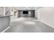 Finished basement with updated carpet, brick accent wall, and dry bar at 3194 S Milwaukee St, Denver, CO 80210