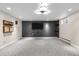 Finished basement media room features a stylish accent wall and modern lighting at 3194 S Milwaukee St, Denver, CO 80210