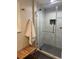 Modern bathroom features a glass shower with designer tile and stylish bench at 3194 S Milwaukee St, Denver, CO 80210