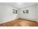 Bedroom features hardwood floors, two large windows and trim at 3194 S Milwaukee St, Denver, CO 80210