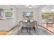 Well-lit dining room with a modern table set and easy access to the kitchen at 3194 S Milwaukee St, Denver, CO 80210