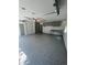 Spacious garage with speckled epoxy flooring, built-in cabinets and workbench, ready for projects and storage at 3194 S Milwaukee St, Denver, CO 80210
