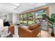 Bright living room features sliding doors to back patio at 3194 S Milwaukee St, Denver, CO 80210