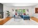 Cozy living room with a large window, hardwood floors, and stylish decor at 3194 S Milwaukee St, Denver, CO 80210