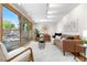 Open living room features sliding doors and seating at 3194 S Milwaukee St, Denver, CO 80210