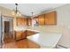 Functional kitchen with light countertops, wood cabinetry, and ample counter space at 5128 S Greenwood Dr, Evergreen, CO 80439