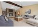 Inviting living room with a stone fireplace, built-in bookshelves, and stylish furniture at 5128 S Greenwood Dr, Evergreen, CO 80439