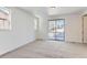 Bedroom with carpet, window and access to deck at 15566 W Beloit Ave, Morrison, CO 80465