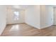 Spacious bedroom with hardwood floors and a large window at 15566 W Beloit Ave, Morrison, CO 80465