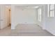 Bright bedroom featuring neutral carpeting and large window at 15566 W Beloit Ave, Morrison, CO 80465