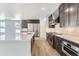 Modern kitchen with stainless steel appliances and ample counter space at 15566 W Beloit Ave, Morrison, CO 80465