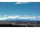 Aerial view of community with mountain backdrop at 1728 Valley Oak Ct, Castle Rock, CO 80104